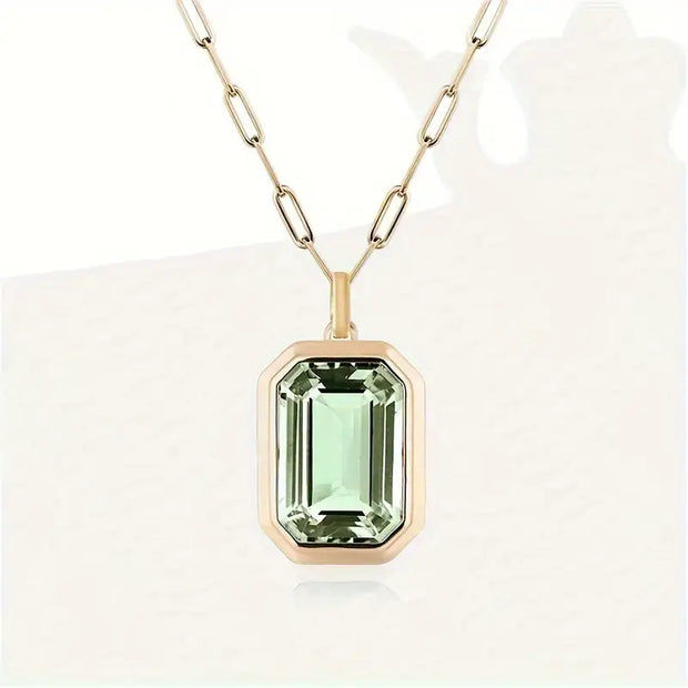 Elegante Goldene Halskette Mit Rechteckigem Anhänger Und Hellgrünen Kristall Von Dorelia
