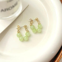 Lime Twist Perlen Creolen Ohrringe Liora Elegant Modern Leichtes Design Mit Goldfarbenem Glanz