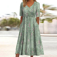Gina – Grünes Midikleid mit Pflanzenprint an der Seite