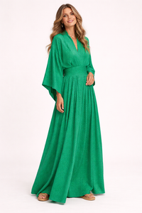 Woman wearing a green dress on a white background