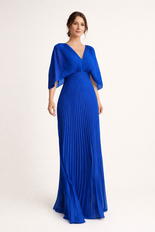 Woman wearing a blue evening gown with a draped top on a white background