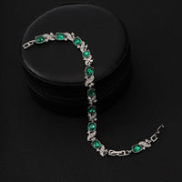 Silberarmband Mit Grünen Ovalen Steinen Und Kubische Zirkonien Verzierungen Lorena Elegantes Schmuckstück