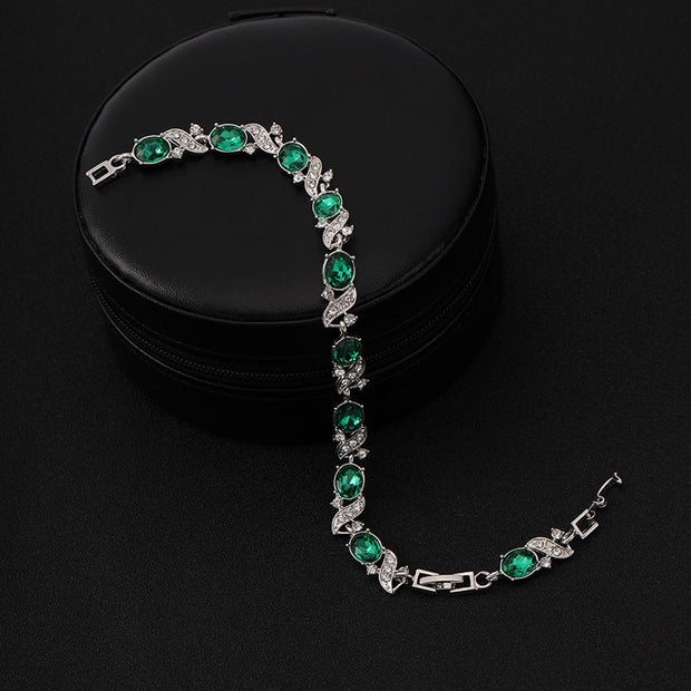 Silberarmband Mit Grünen Ovalen Steinen Und Kubische Zirkonien Verzierungen Lorena Elegantes Schmuckstück