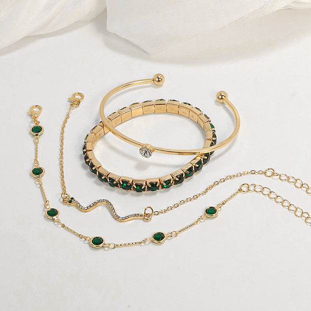 Vier Elegante Goldene Armband-Set Mit Grünen Details Smeralda - Minimalismus Und Strahlender Glanz