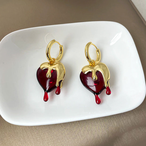 Ohrringe Heart Melts Von Inez Mit Dem Durchscheinenden Herz Im Goldenen Schmelzdesign Für Ausdrucksstarke Eleganz