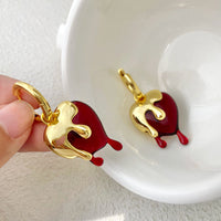 Ohrringe Heart Melts Von Inez Mit Dem Durchscheinenden Herz Im Goldenen Schmelzdesign Für Ausdrucksstarke Eleganz