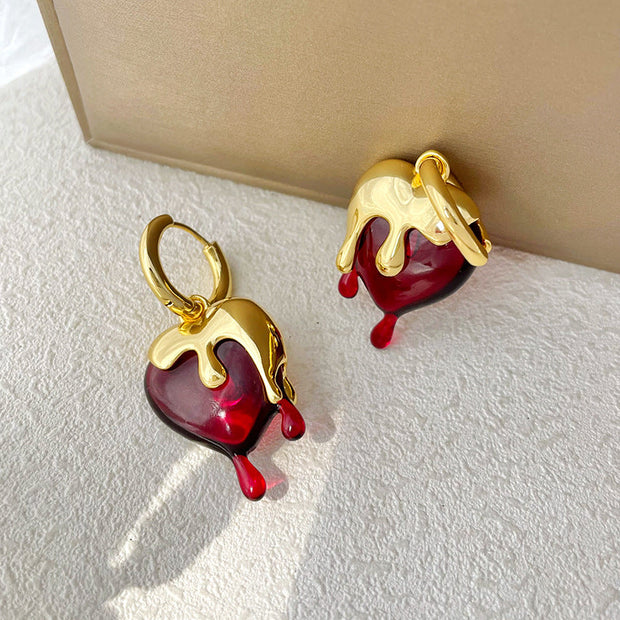 Ohrringe Heart Melts Von Inez Mit Dem Durchscheinenden Herz Im Goldenen Schmelzdesign Für Ausdrucksstarke Eleganz