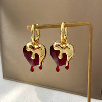 Ohrringe Heart Melts Von Inez Mit Dem Durchscheinenden Herz Im Goldenen Schmelzdesign Für Ausdrucksstarke Eleganz
