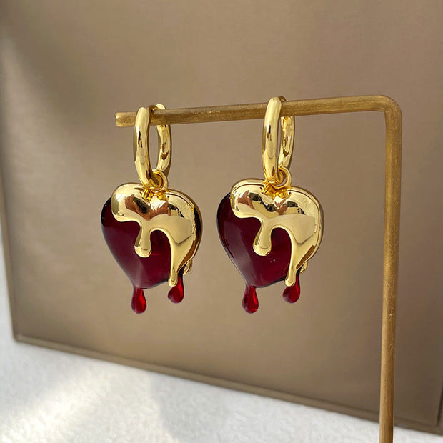 Ohrringe Heart Melts Von Inez Mit Dem Durchscheinenden Herz Im Goldenen Schmelzdesign Für Ausdrucksstarke Eleganz