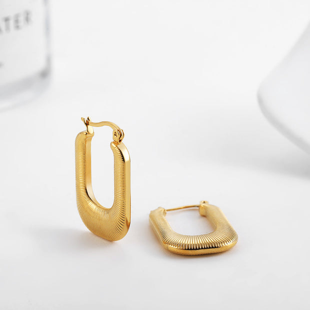 Ohrringe Luxe Arches Thalia Elegante Zeitgenössische Rechteckige Form Mit Sanft Abgerundeten Linien Und Goldglanz