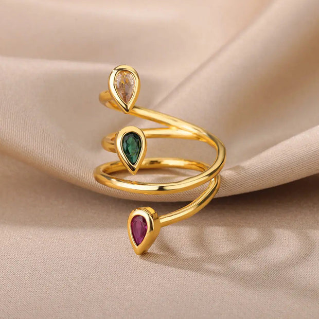 Edelstein Spiralring Inaya Mit Drei Tropfenförmigen Steinen In Transparent Grün Rot Gold Finish
