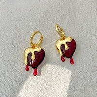 Ohrringe Heart Melts Von Inez Mit Dem Durchscheinenden Herz Im Goldenen Schmelzdesign Für Ausdrucksstarke Eleganz