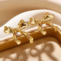 Zarte Doppelohrringe Mit Schleife Leila Goldenes Finish Schmuck Für Romantische Looks