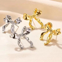 Zarte Doppelohrringe Mit Schleife Leila Goldenes Finish Schmuck Für Romantische Looks