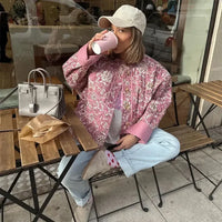 Steppjacke mit figurbetontem Schnitt, Blumenmuster und Knopfverschluss