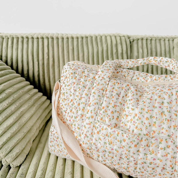 Daisy Wickeltasche mit Blumenmuster