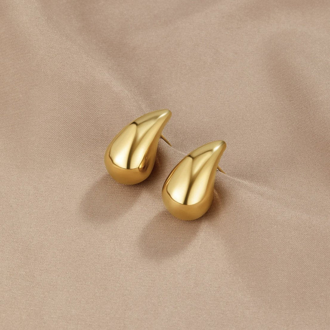 Goldene Tropfenohrringe Ame Ondina Schlichtes Minimaldesign Trifft Moderne Eleganz Ideal Für Formelle Und Alltagslook