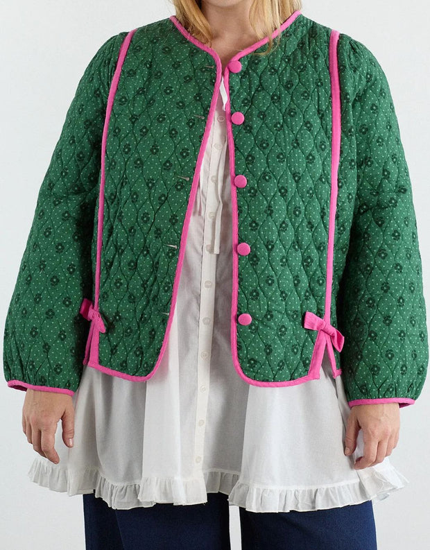 Steppjacke mit Blumenmuster und rosa Schleifen