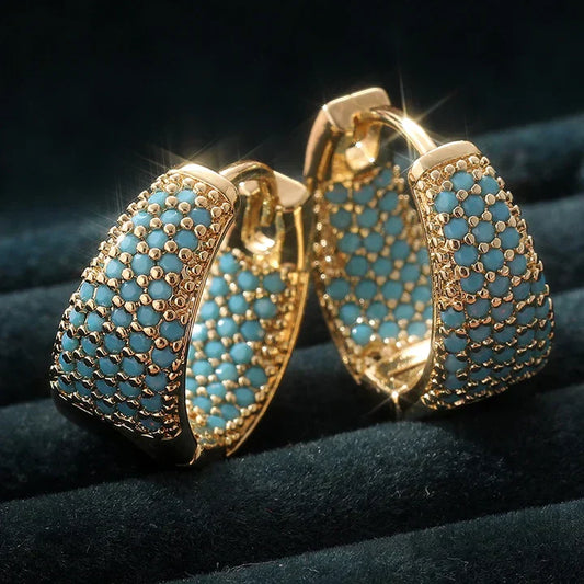 Vergoldete Ohrringe Mit Blauen Steinen Von Maren Elegant Glänzendes Schmuckstück Für Glamour Und Alltag