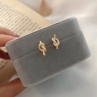 Ohrringe Duo Gnarled Patrizia Modernes Doppelknoten Design Aus Poliertem Metall Für Elegante Looks