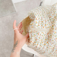 Daisy Wickeltasche mit Blumenmuster